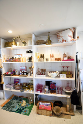 Shelves with home decor gifts from the Details and Design boutique in Annapolis, Maryland.