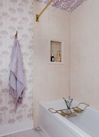 Bathroom design with bath items and wallpaper on walls and ceiling.
