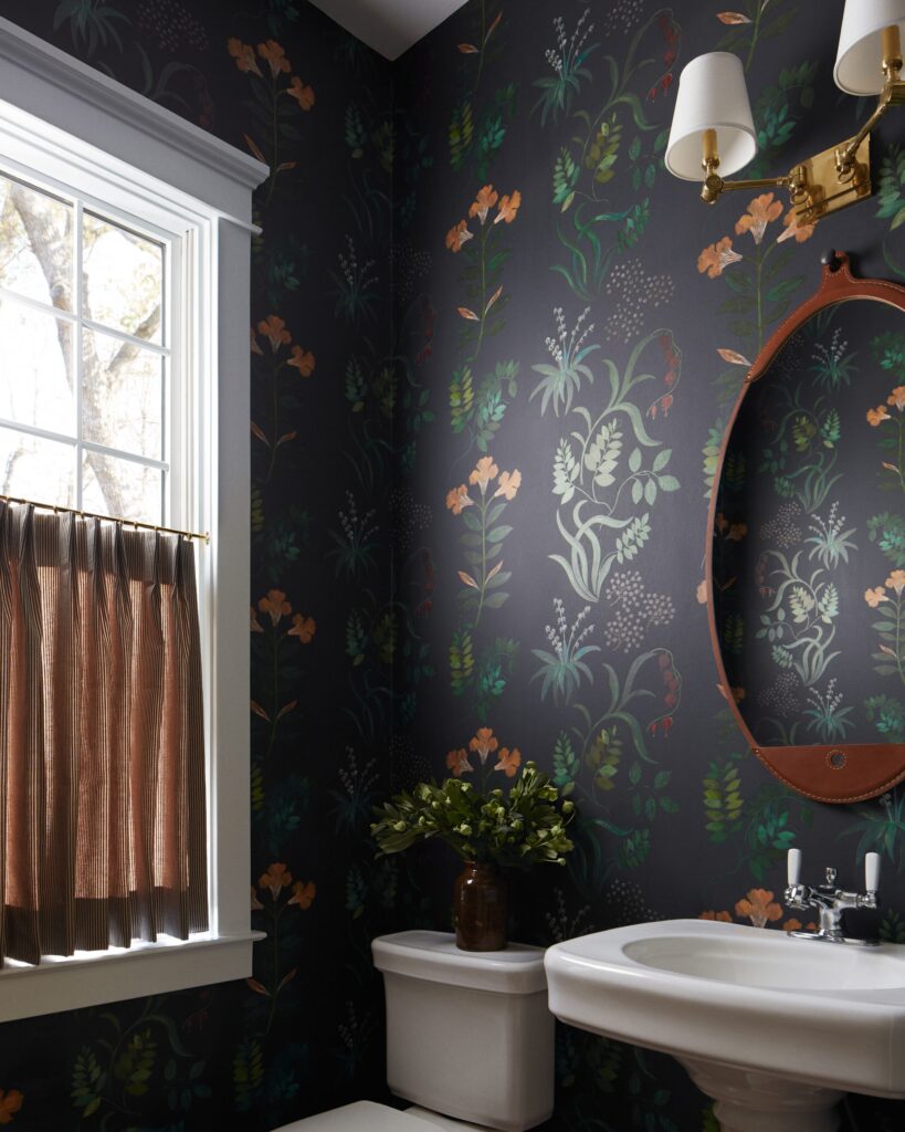 Bold wallpaper accent for bathroom designed in Kensington