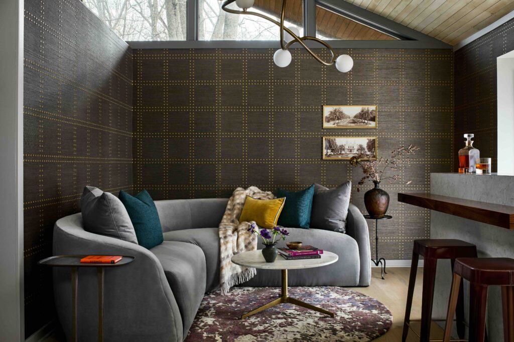 Annapolis home renovation upgraded living room with dark accent walls and pillows